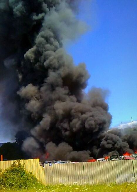 SMOKE EMITTING FROM LANDSCAPE AGAINST THE SKY