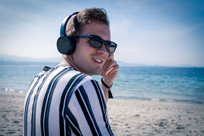 Portrait of young man on beach