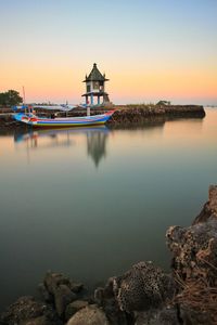 Scenic view of sea against sky at sunset
