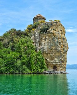 Built structure on cliff by sea