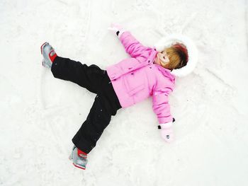 High angle view of cute girl on snow