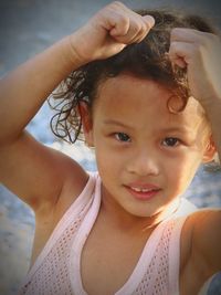 Close-up portrait of cute girl outdoors