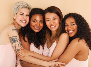 Portrait of friends against white background