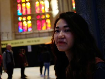 Portrait of smiling woman at night