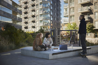 Friends at playground talking