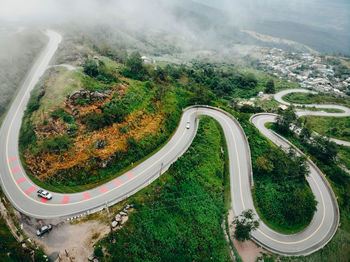 High angle view of road amidst trees