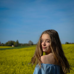 Portrait of teenager on field