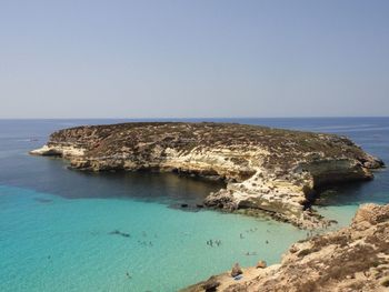 Scenic view of sea against clear blue sky