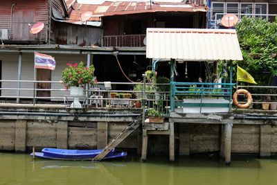 Buildings by river in city