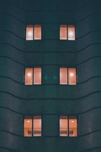 Low angle view of illuminated building at night