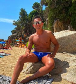 Portrait of smiling young man on beach