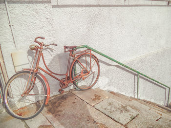 Bicycle leaning on wall