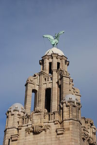 The upper parts of the iconic liver building in liverpool, uk