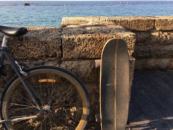 Close-up of old bicycle against wall