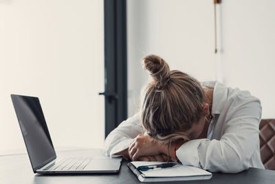 Woman using laptop at home