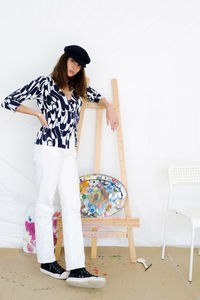 Young female artist in her painting studio