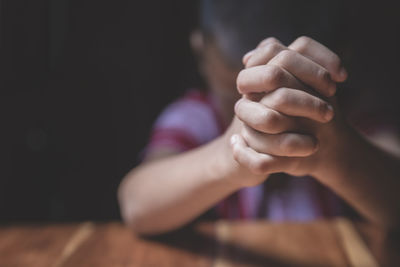 A little prayer, a boy is praying seriously and hopefully to jesus.