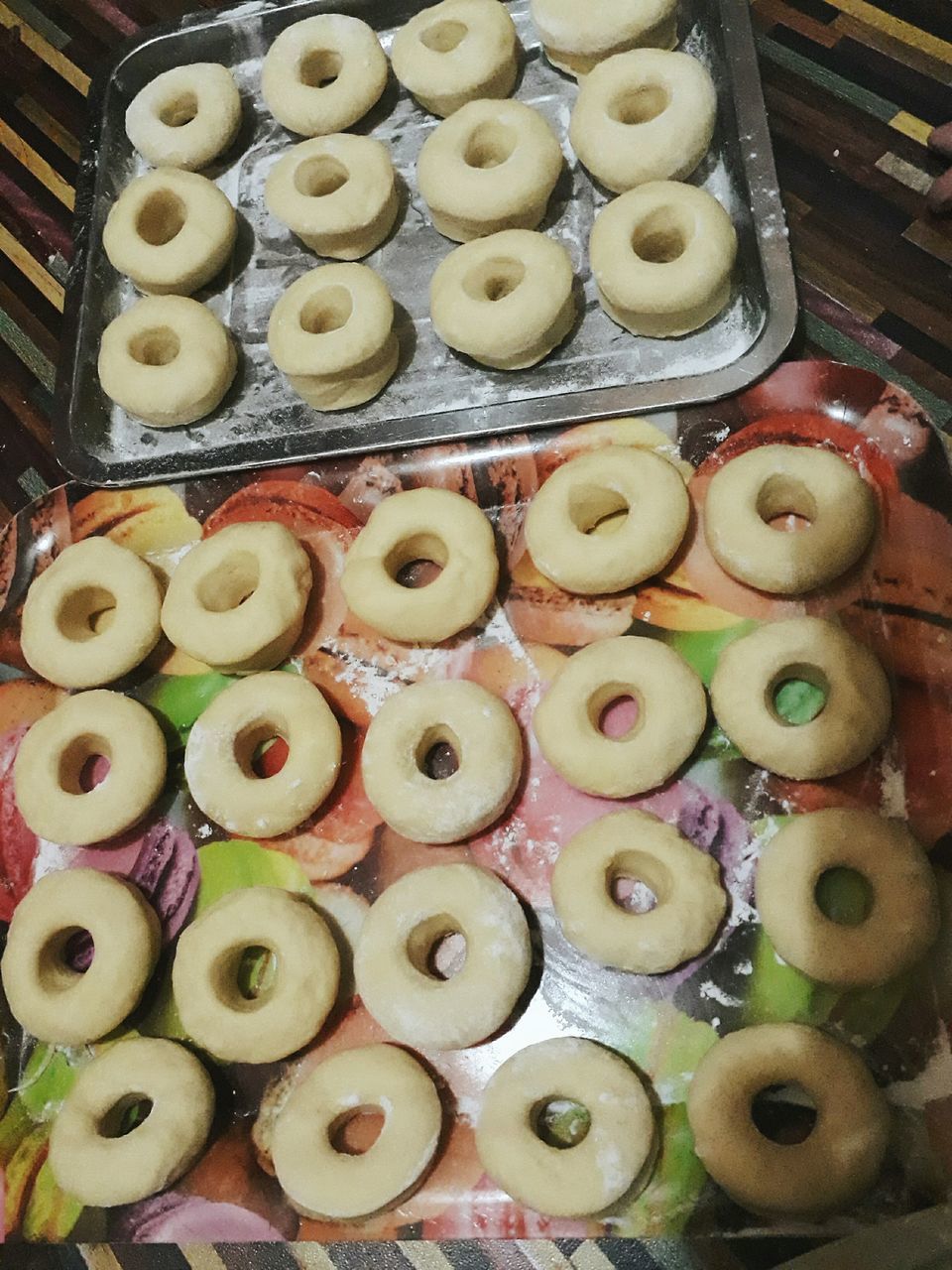 food and drink, food, indoors, large group of objects, no people, high angle view, indulgence, ready-to-eat, variation, close-up, directly above, arrangement, freshness, sweet food, multi colored, donut, day