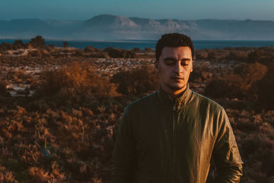 Portrait of man standing outdoors