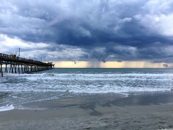 Scenic view of sea against cloudy sky