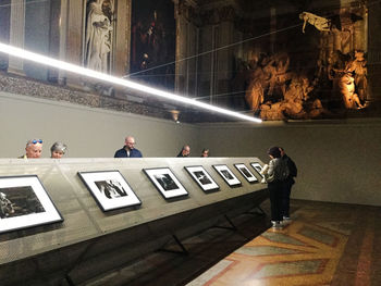 People looking at illuminated building