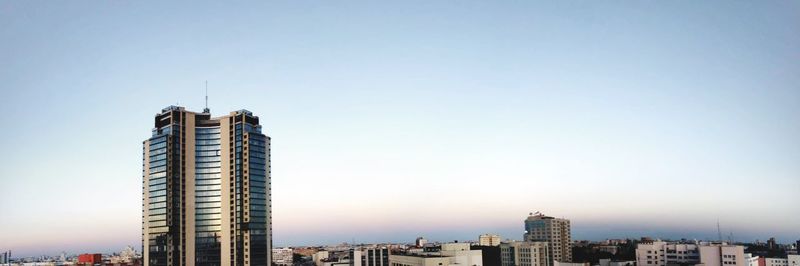 Modern buildings against clear sky