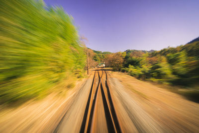 Blurred motion of train on railroad track