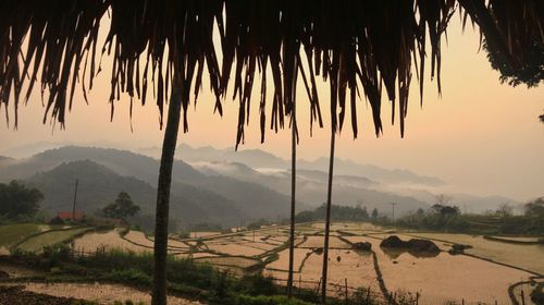 Scenic view of landscape against sky during sunset