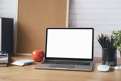 Mock up blank white screen laptop.