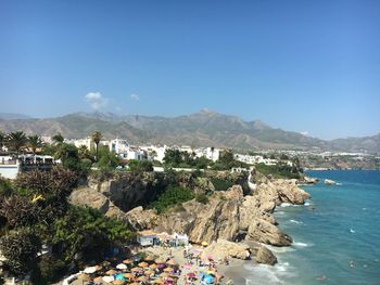 Scenic view of sea against clear blue sky