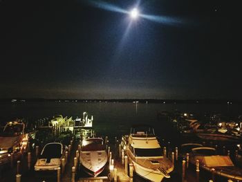 View of illuminated sea at night