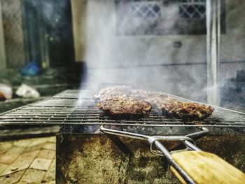 Close-up of meat on barbecue grill