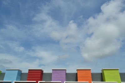 Low angle view of multi colored building against sky