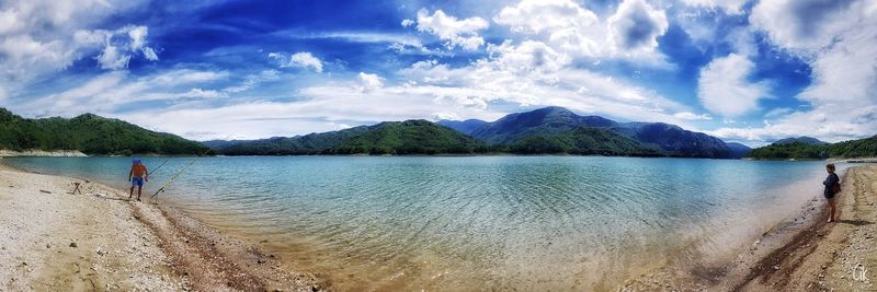 Panoramic shot of calm lake against mountain range