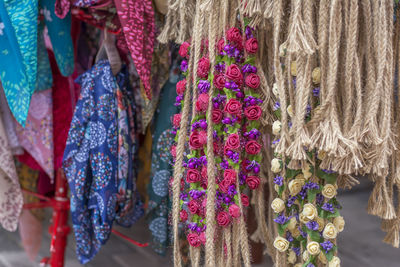 Close-up of textile and decoration hanging for sale in market