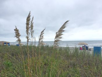 Scenic view of sea against cloudy sky