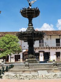 Low angle view of fountain against building