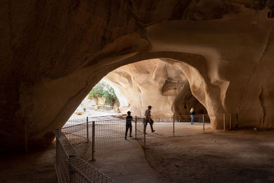 People walking in cave