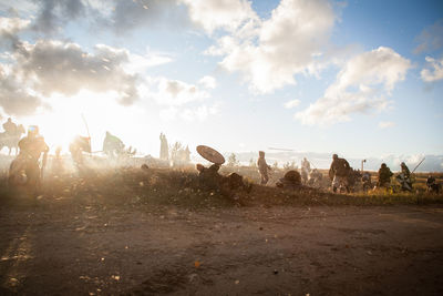 Soldiers fighting during war against sky during historical reenactment