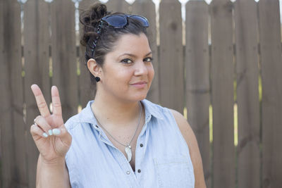 Portrait of young woman standing outdoors