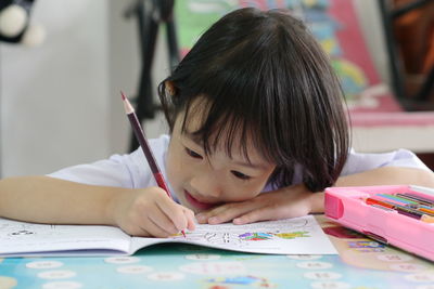 Portrait of a girl sitting on table