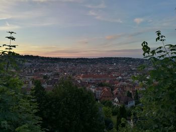 Aerial view of city against sky during sunset