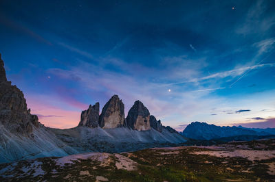 Scenic view of mountains against sky during sunset. tre cime di lavaredo, dolomites