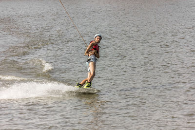 Man kite boarding in river