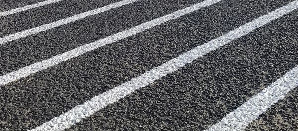 Full frame shot of zebra crossing on road