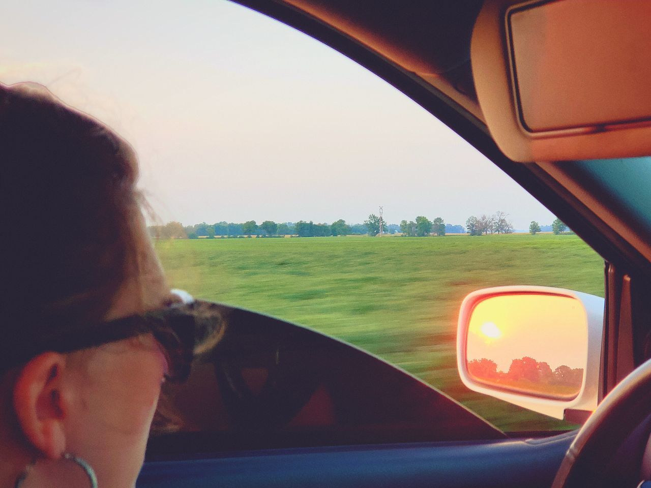 PORTRAIT OF WOMAN IN CAR