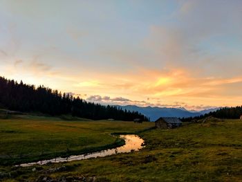 Scenic view of landscape against sky during sunset