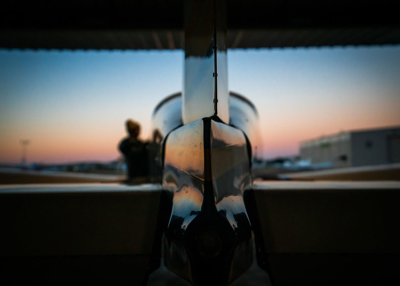 MAN SEEN THROUGH GLASS WINDOW