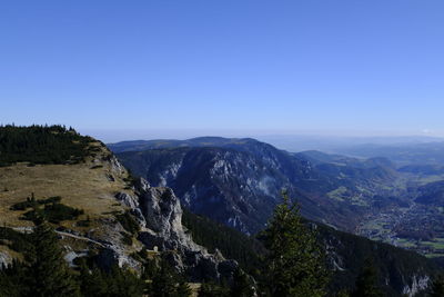 Scenic view of mountains against clear blue sky