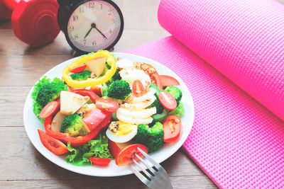 High angle view of fruits in plate on table